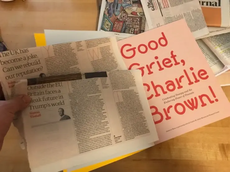Ein Zeitungsausschnitt mit dem Schriftzug "Good Grief, Charlie Brown"