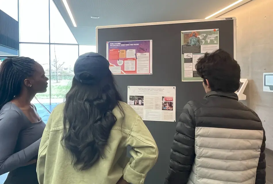 MPP students discussing the posters and thesis projects