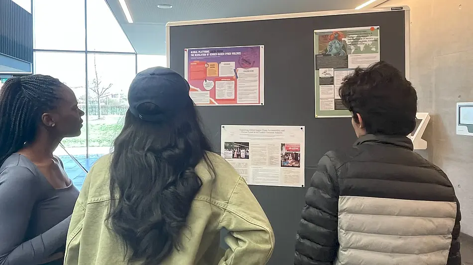 MPP students discussing the posters and thesis projects