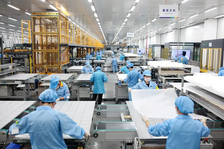  Solar panels being produced at a factory in Ningbo, China