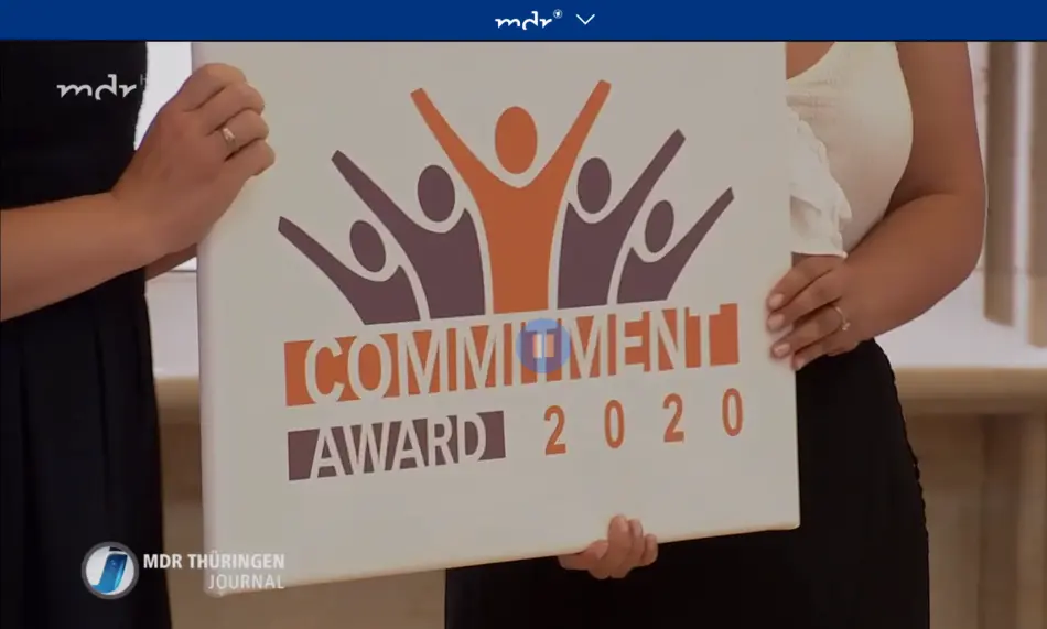 hands holding award trophy