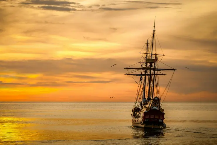 sail ship at sunset
