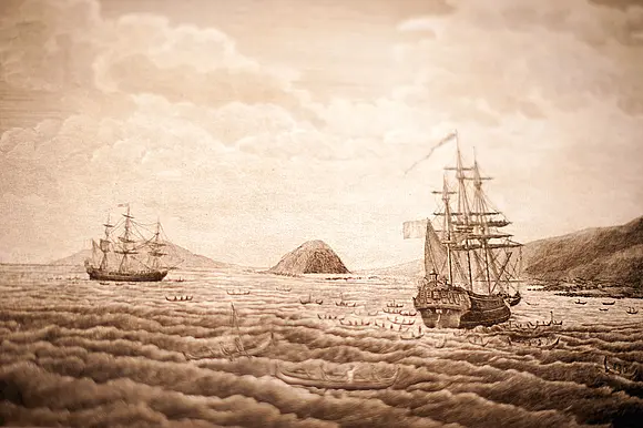 Sepiafarbenes Bild mehrerer Segelschiffe auf einem Meer.