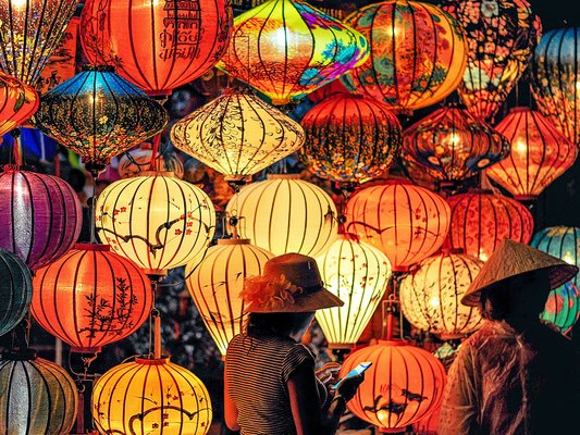 two-person-standing-near-assorted-color-paper-lanterns_photo by min an from pexels