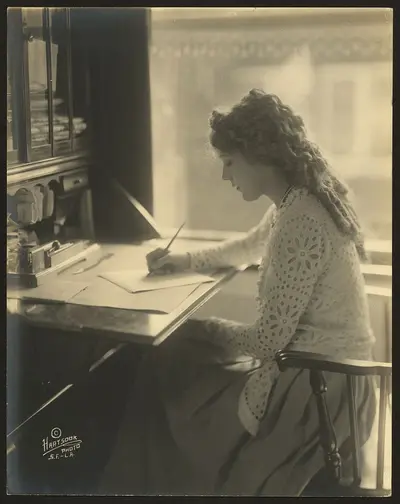 girl sitting at a desk writing